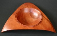 Red Mahogony Bowl - 
	TA piece of Red Mahogony, turned, cut on a banssaw and then sanded to
